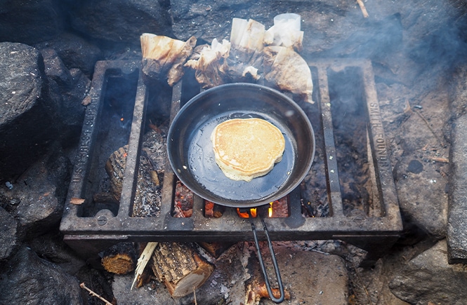 Making pancake breakfast at camp at Boundary Waters Canoe Area Wilderness