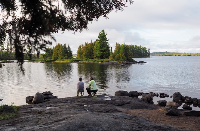 watching the sun rise over the lake at Boundary Waters Canoe Area Wilderness
