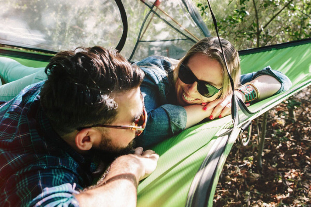 tentsile connect 2-person tree tent with two people inside